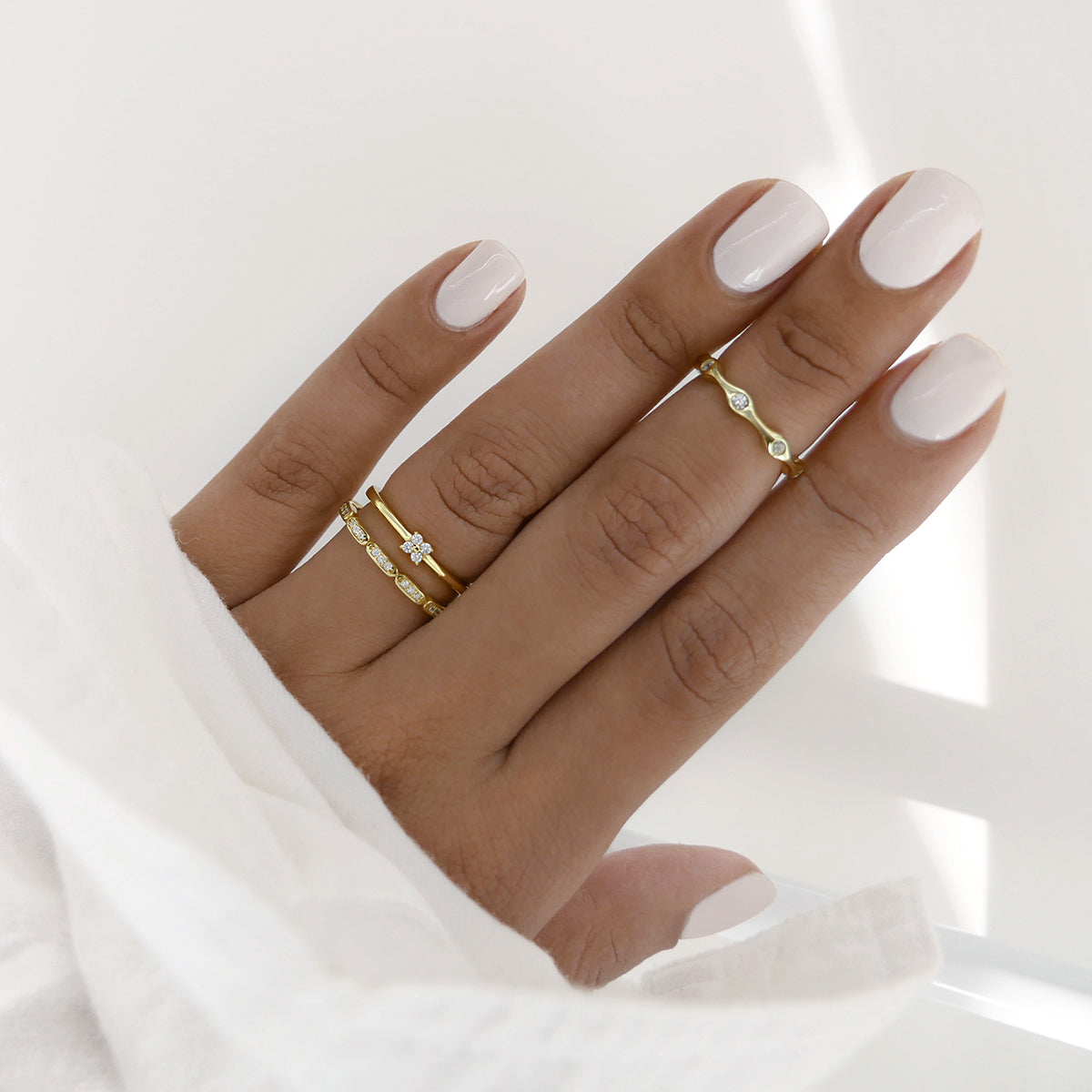 gold rings styled on hand