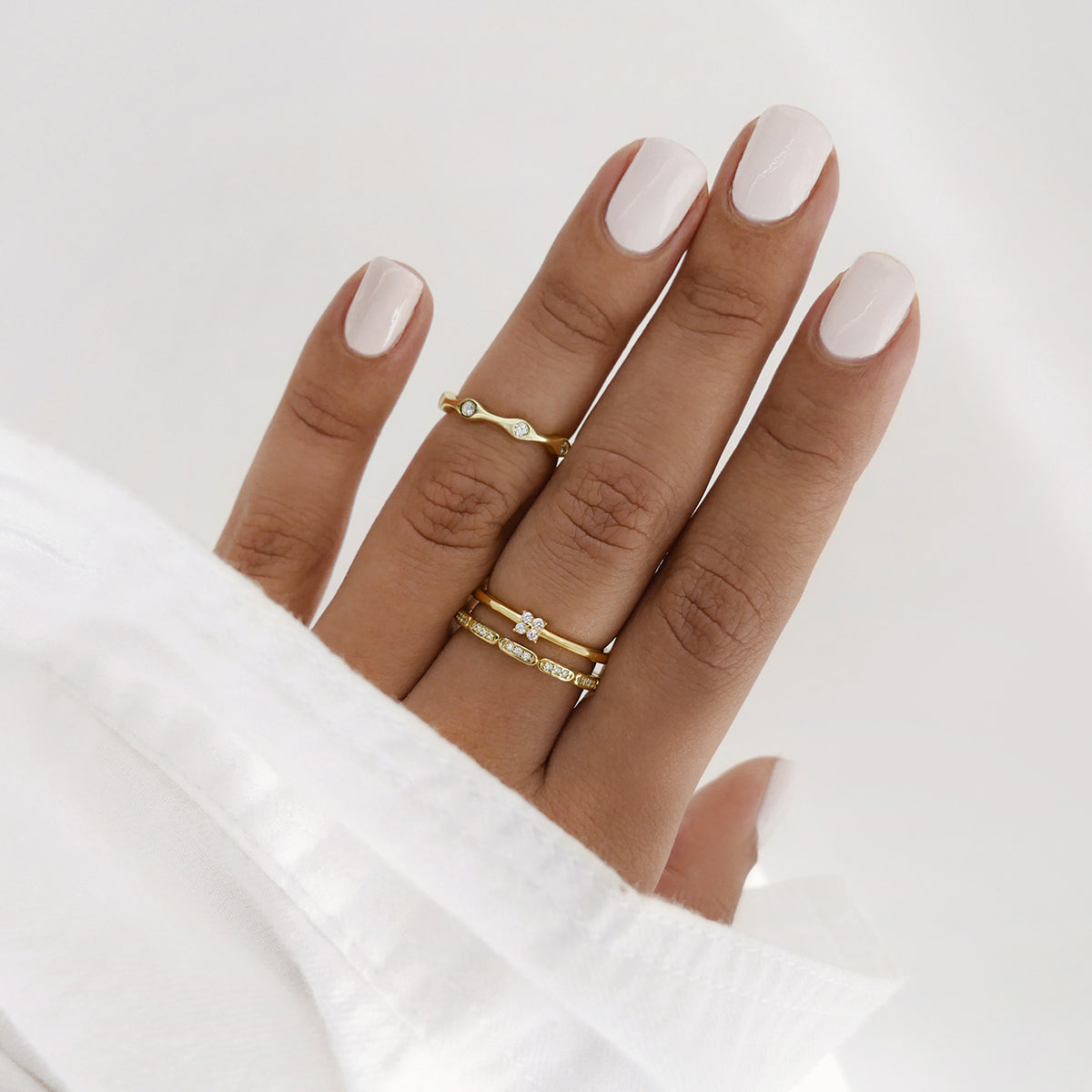 gold rings styled on hand