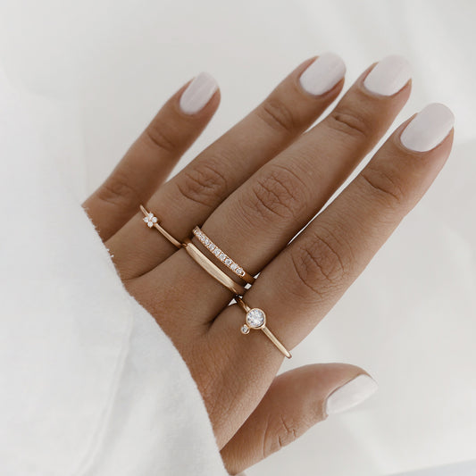 rose gold rings styled on middle three fingers