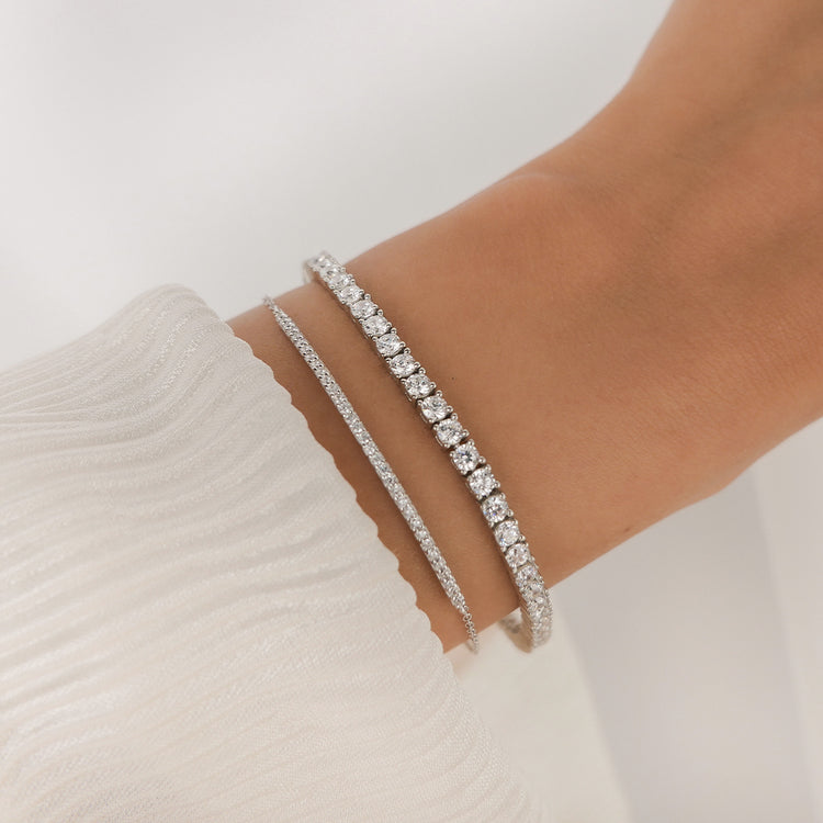 The Tennis Bracelet Silver with Zirconia Stone Settings layered with Layla Bracelet